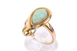 A yellow metal and turquoise ring. The stone of teardrop form 1.2cm x 3.