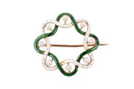 A yellow metal and enamel wreath brooch.