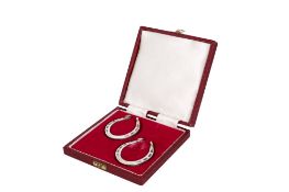 A pair of silver horseshoes. Hallmarked Francis Howard Ltd, Sheffield 1971, H5.5cm, weight 50.