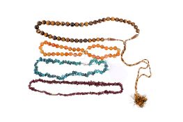 Four natural stone necklaces.