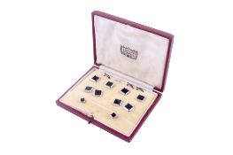 A 9ct white gold and onyx dress shirt set.