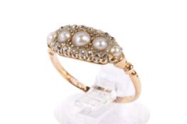 An antique dress ring. Set with five graduated half pearls with a border of old single cut diamonds.