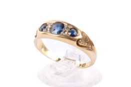 An 18ct gold and sapphire ring.