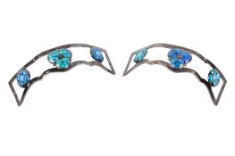 Two James Fenton silver and enamel decorative elements.