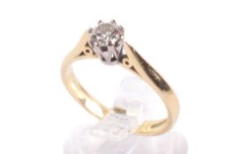 An 18ct gold and diamond solitaire ring. The round cut diamond circa 0.