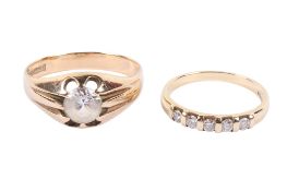 Two 9ct gold rings. One set with five stones of total of 0.