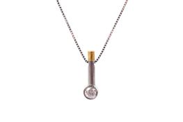 A platinum and yellow gold drop diamond pendant. Set with one round brilliant cut diamond of 0.