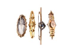 Four 19th/early 20th century gold and yellow metal brooches.