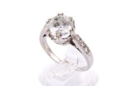 A white metal and diamond ring.