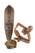 A group of three assorted African Tribal items. Including a mask, a carved figure and a tambourine.