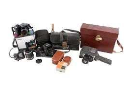 A group of assorted cameras. Including a Carl Zeiss Jena DDR S 1:3.5 f=135 lens, etc.