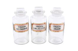 Three vintage chemist glass storage jars with labels. 'Troch:'.