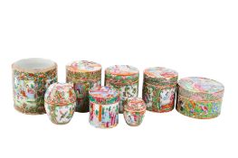 A group of late 19th century Chinese Canton famille rose lidded boxes.