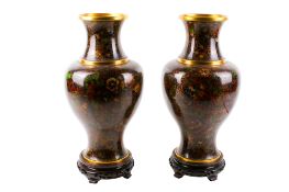 A pair of 20th century cloisonné vases on stands.