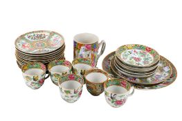 A group of 19th century Chinese Canton plates, saucers and cups.