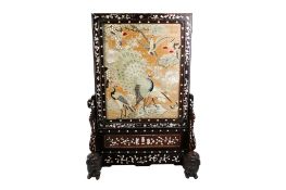A 19th century Chinese embroidered fire screen.
