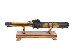 A Chinese implement set on a stand.