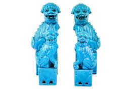 Four 20th century Chinese blue glazed dogs of fo.