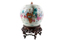 A large 19th century Chinese globular jar on a hardwood stand.