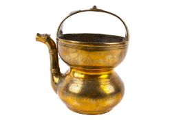 An Indian brass holy water vessel.