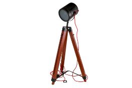 A contemporary style spot light. Mounted on a wooden tripod base (AF), approximate height 100cm.