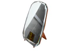 A mid-century frameless easel back dress mirror. Having a bevelled edge plate.