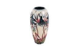 A small modern Moorcroft Minuet vase. Designed by Emma Bossoms, dated 2004, marks to the base.