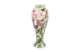 Moorcroft Sweet Pea Collectors Club vase on a pale green ground. Marks to the base.