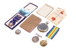 A small group of WWI medals and collectables belonging to Harry Gill,