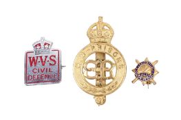 Three military and civil badges.