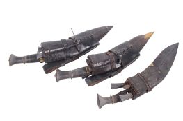 Three vintage Nepalese/Gurkha style kukri knife daggers.