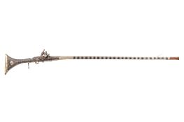 An antique Middle Eastern Miquelet flint lock musket. Engraved metalwork decoration circa 1740.