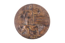 A WWI bronze death plaque awarded to Alfred Martin. The verso marked 'KIA 1.7.