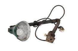 A vintage industrial work lamp. With a green painted metal shade.