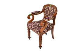 A Victorian oak scroll open armchair.