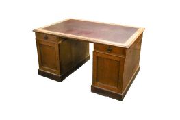 An early 20th century oak twin pedestal partner's desk.