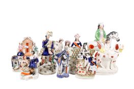 A collection of ten assorted Staffordshire pottery flat back figures.