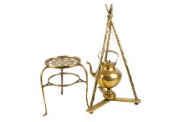 A vintage brass kettle on a stand and a trivet stand.