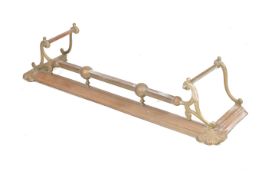 An Edwardian brass and copper fender. With C-end scroll supports and spherical details.