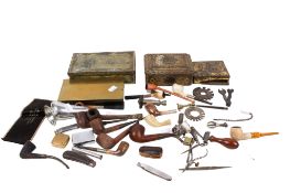 A collection of assorted smoker's pipes and smoking related ephemera. Including some tins, etc.