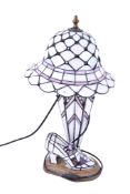 A modern novelty Tiffany style leaded glass table lamp. In the form of a hat, umbrella and a shoe.