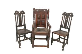 Three antique carved oak chairs.