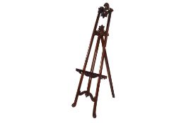 Reproduction carved mahogany finish picture easel. Carved floral and swag details.