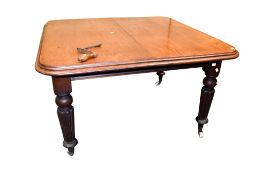 Victorian mahogany extending dining table with winding handle.
