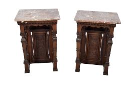 A pair of marble topped mahogany console tables.