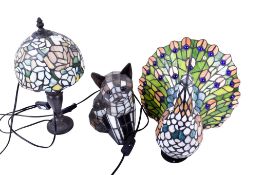 Three modern leaded glass Tiffany style table lamps.