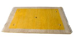 A contemporary yellow and beige wool rug. Having a yellow centre and beige border.