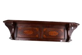 An Edwardian inlaid oak wall shelf.