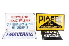 A collection of assorted vintage Polish language enamel warning signs.
