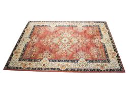 Tabriz Antique style wool rug on terracotta / gold ground.
